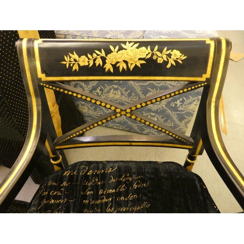 200 - A pair of Regency style black painted and gilt framed elbow chairs with crossover splats and open ar... 