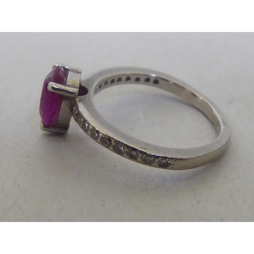 205 - An 18ct white gold rubellite and diamond claw set ring 