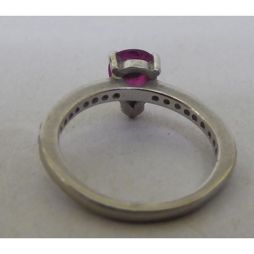 205 - An 18ct white gold rubellite and diamond claw set ring 