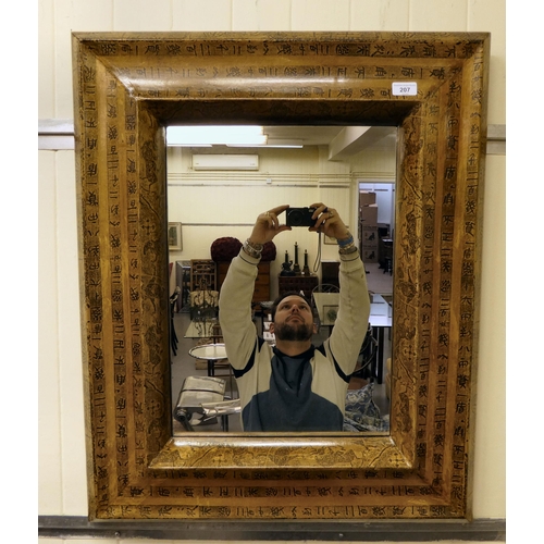 207 - A modern mirror, set in a black and beige printed frame  33