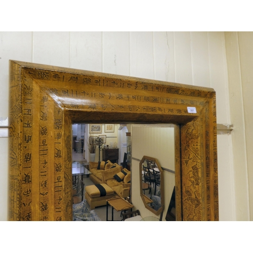 207 - A modern mirror, set in a black and beige printed frame  33