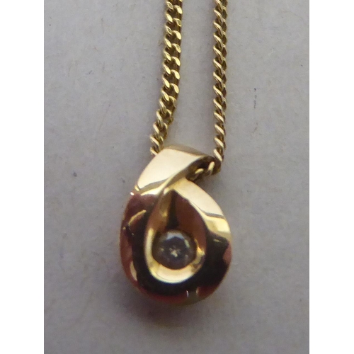 214 - A 9ct gold and diamond set pendant, on a fine neckchain and ring bolt clasp 