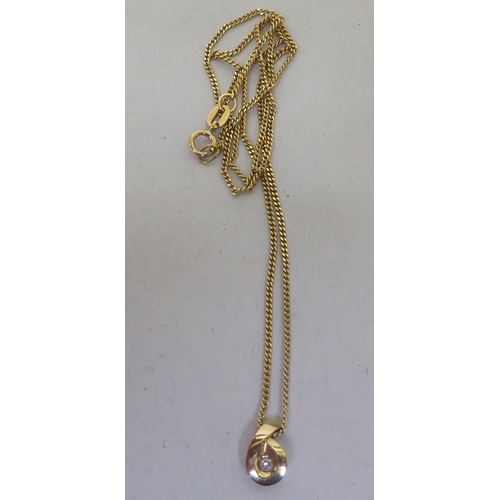 214 - A 9ct gold and diamond set pendant, on a fine neckchain and ring bolt clasp 