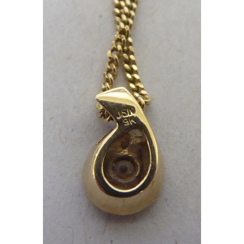 214 - A 9ct gold and diamond set pendant, on a fine neckchain and ring bolt clasp 