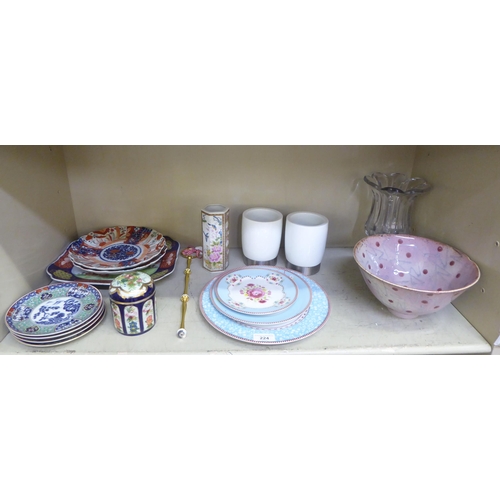 224 - A mixed lot: to include a pair of early 20thC Japanese porcelain Imari plates, decorated with flora&... 