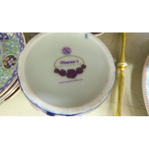 224 - A mixed lot: to include a pair of early 20thC Japanese porcelain Imari plates, decorated with flora&... 