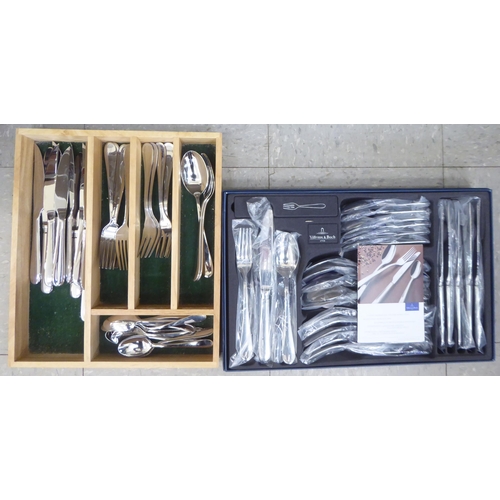 230 - A Villeroy & Bosh stainless steel set of cutlery and flatware, in a fitted case; and another, si... 