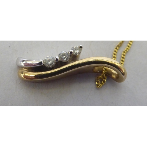 231 - A 9ct bi-coloured gold and three stone diamond set pendant, on a fine neckchain and ring bolt clasp&... 