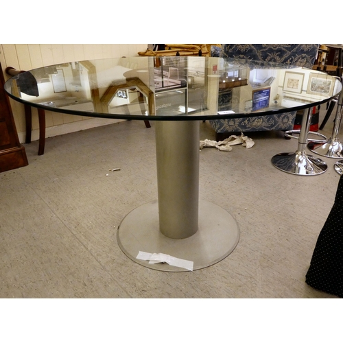 241 - A modern cast metal breakfast table with a glass top  30