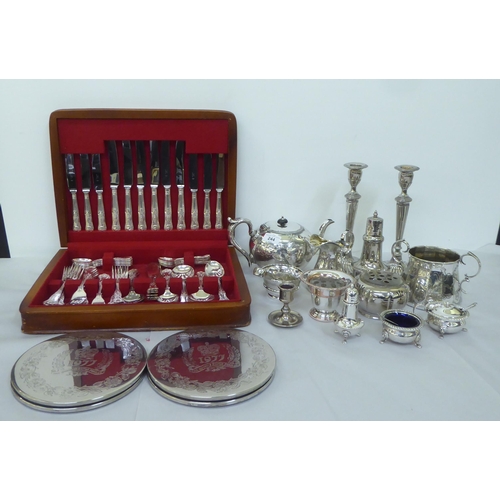 244 - Silver plate: to include a pair of candlesticks, each with a reeded column and an oval foot  10... 