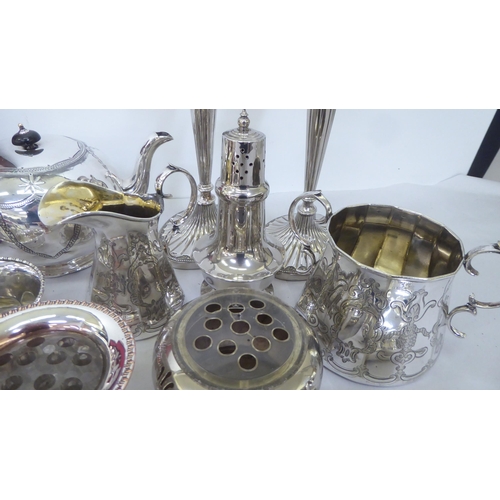 244 - Silver plate: to include a pair of candlesticks, each with a reeded column and an oval foot  10... 