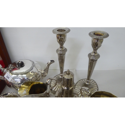 244 - Silver plate: to include a pair of candlesticks, each with a reeded column and an oval foot  10... 