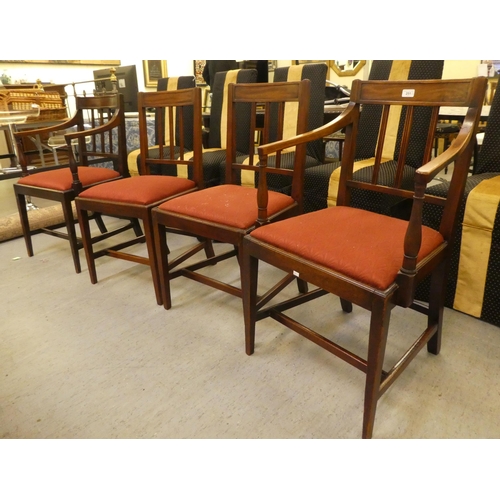 251 - A set of four early 19thC mahogany framed dining chairs, each with a slatted black and drop-in seat,... 