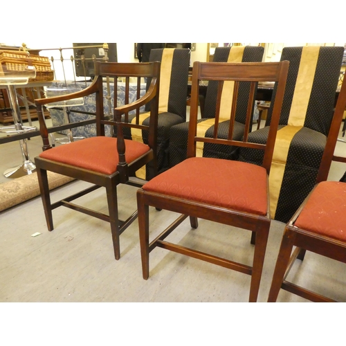 251 - A set of four early 19thC mahogany framed dining chairs, each with a slatted black and drop-in seat,... 