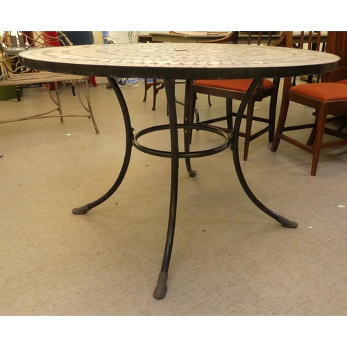 252 - A Kettler composition mosaic top garden table, on a wrought metal base  30