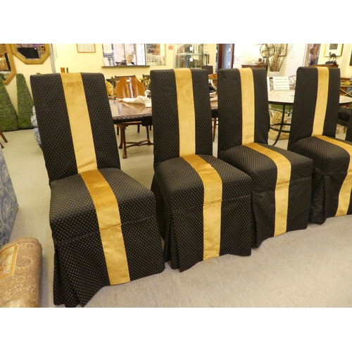 253 - A set of six black and gold fabric covered dining chairs, raised on stained beech legs 