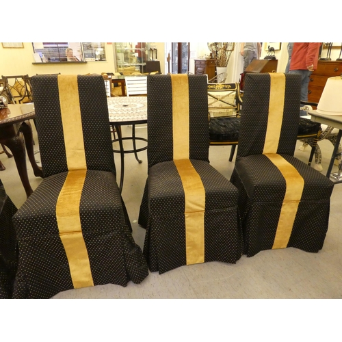 253 - A set of six black and gold fabric covered dining chairs, raised on stained beech legs 