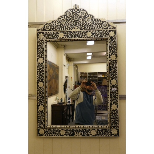 254 - A modern Middle Eastern inspired mirror, decorated in black and white floral designs  41