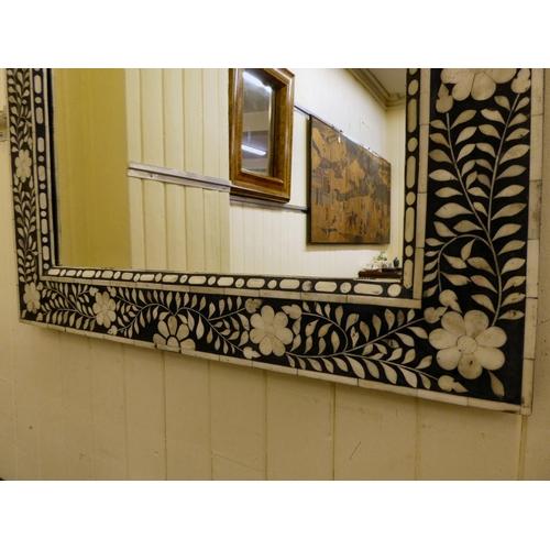 254 - A modern Middle Eastern inspired mirror, decorated in black and white floral designs  41