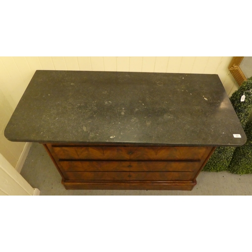 257 - A 19thC design mahogany commode with a black marble top, over four long drawers, on a plinth  3... 