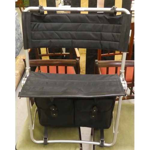 259 - A Bantam folding canvas and aluminium chair with integral game bag 