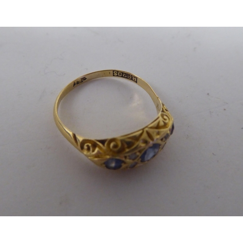 53 - An 18ct gold sapphire and diamond set gypsy style ring 