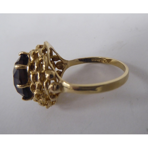 54 - A 9ct gold signet ring; and a 9ct gold smoky quartz set ring