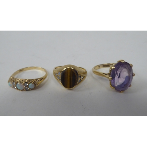 61 - Three 9ct gold rings, variously stone set