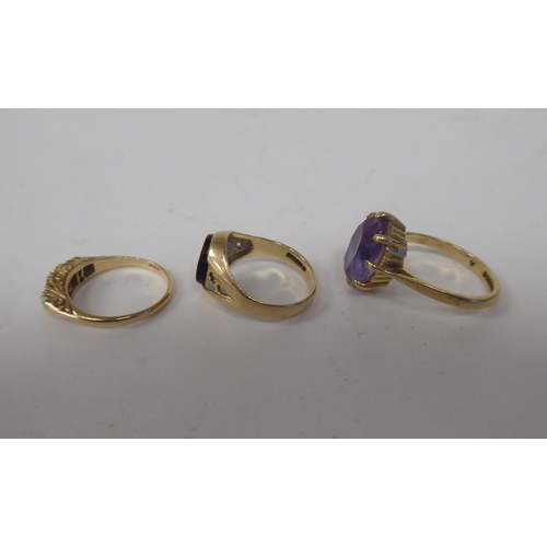 61 - Three 9ct gold rings, variously stone set