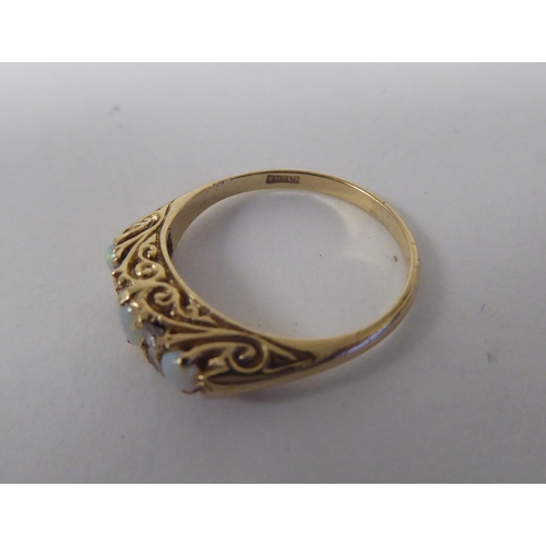 61 - Three 9ct gold rings, variously stone set