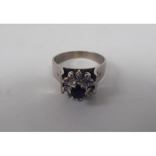 62 - An 18ct white gold diamond and sapphire cluster ring