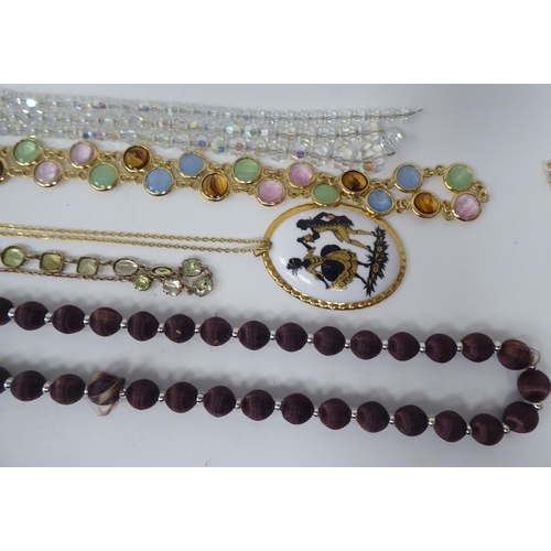 64 - Costume jewellery and silver flatware: to include bead necklaces