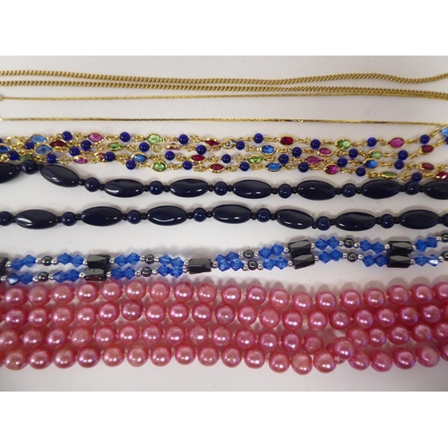 64 - Costume jewellery and silver flatware: to include bead necklaces