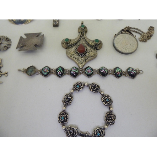 66 - Silver, silver coloured and white metal items of personal ornament: to include a pair of earrings; a... 