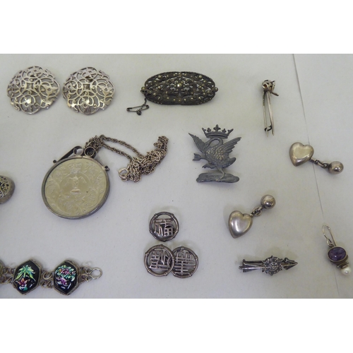 66 - Silver, silver coloured and white metal items of personal ornament: to include a pair of earrings; a... 