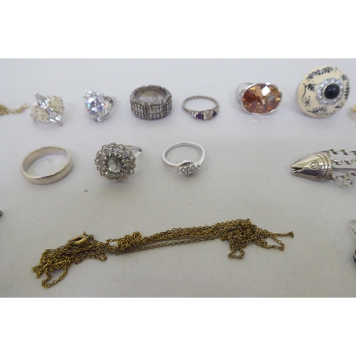 76 - Silver, white metal and other items of personal ornament: to include a fish design brooch; and dress... 