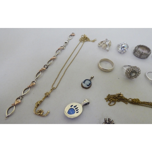 76 - Silver, white metal and other items of personal ornament: to include a fish design brooch; and dress... 