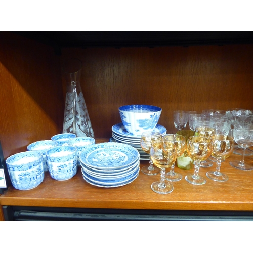 80 - Ceramics and glassware: to include blue and white china tableware, decorated in a version of the Wil... 