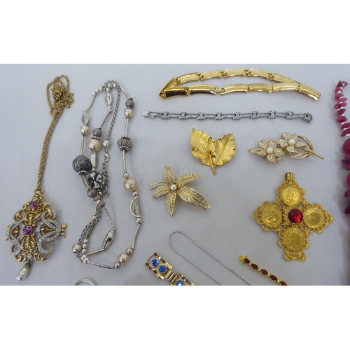 82 - Costume jewellery: to include yellow metal, coloured bead necklaces; coin and other pendants