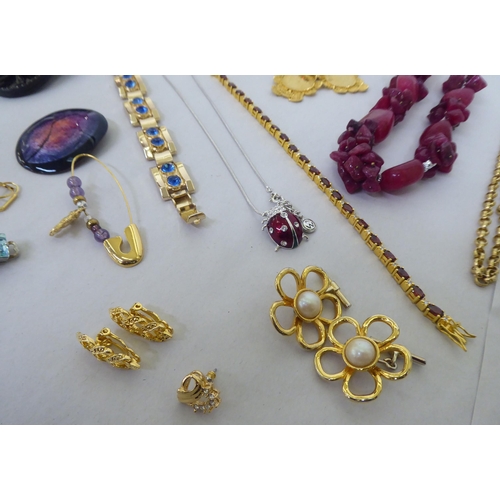 82 - Costume jewellery: to include yellow metal, coloured bead necklaces; coin and other pendants