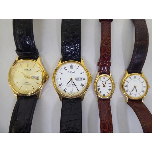 86 - Modern wristwatches; a Dunhill gas filled, red enamel and yellow metal cigarette lighter; and a Dunh... 