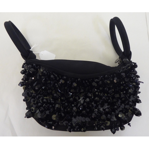 98 - A Lulu Guinness black and bead ornamented handbag with loop handles and dust cover