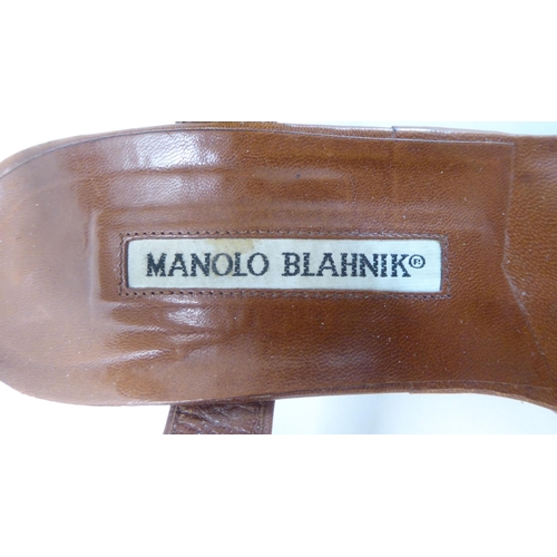 1 - A pair of ladies Manolo Blahnik stitched tan coloured leather and faux fur strapped, heeled, open to... 