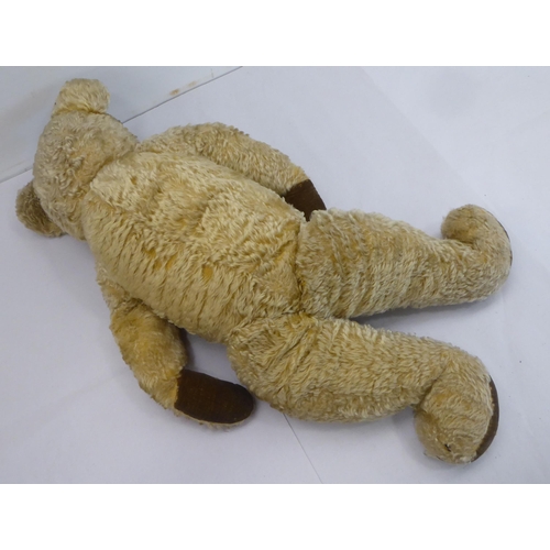 100 - Teddy bears: to include a 1930s Merrythought beige mohair example with mobile limbs  27