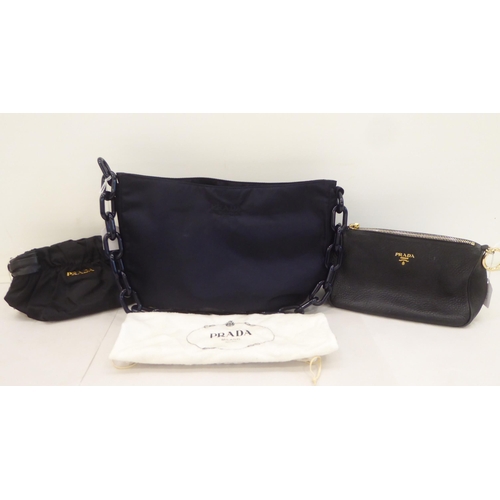 113 - A Prada Borsa in Tessuto Bleu handbag with plastic chain handle; a Prada black jacquard reticule typ... 