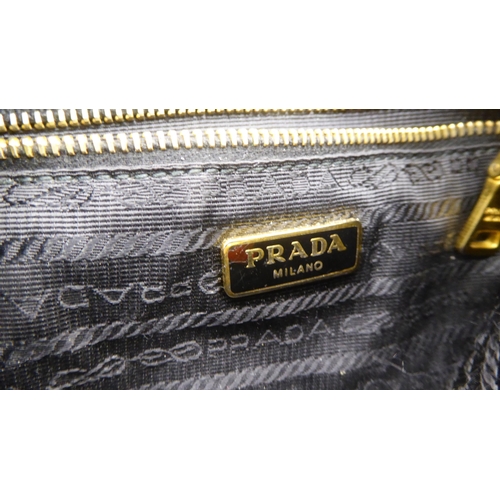 113 - A Prada Borsa in Tessuto Bleu handbag with plastic chain handle; a Prada black jacquard reticule typ... 