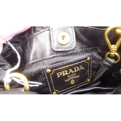 113 - A Prada Borsa in Tessuto Bleu handbag with plastic chain handle; a Prada black jacquard reticule typ... 