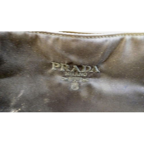 113 - A Prada Borsa in Tessuto Bleu handbag with plastic chain handle; a Prada black jacquard reticule typ... 