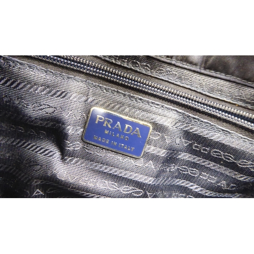 113 - A Prada Borsa in Tessuto Bleu handbag with plastic chain handle; a Prada black jacquard reticule typ... 