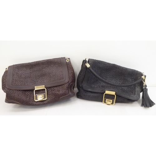 116 - Two Anya Hindmarch shoulder bags, one black, one brown with dust covers 